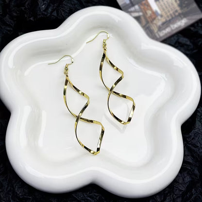 Spiral Dangle Oorbellen | Goud